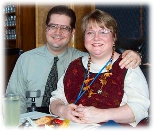 John and Trish sitting at a restaurant table